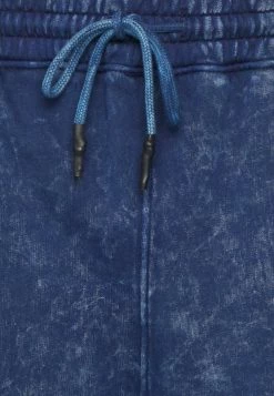 Mennace WASHED BADGE JOGGER UNISEX - Tracksuit Bottoms - Blue -Mennace Shop Online 06e002dd32254bea807bed809979d536