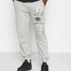 Mennace UNISEX LOGO REGULAR - Tracksuit Bottoms - Light Grey -Mennace Shop Online 23ef2beb2530435f89be2addf4a328c4