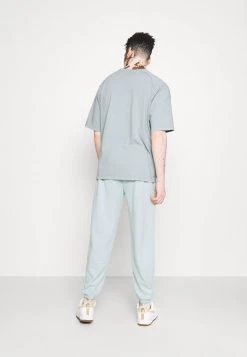 Mennace ESSENTIAL JOGGER UNISEX - Tracksuit Bottoms - Light Blue -Mennace Shop Online 2ce1959de5db44019c169b4d96711497