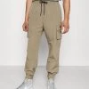 Mennace TECH TRACKSUIT BOTTOM - Cargo Trousers - Tan 1 Mennace TECH TRACKSUIT BOTTOM - Cargo Trousers - Tan -Mennace Shop Online 3ecdb42202e54ed58258bff4bc35d50a