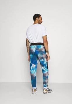 Mennace TIE DYE UNISEX - Tracksuit Bottoms - Blue 12 Mennace TIE DYE UNISEX - Tracksuit Bottoms - Blue -Mennace Shop Online a594be2d02d046199b79459fdf527c45