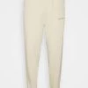 MENNACE UNISEX - Tracksuit Bottoms - Neutral