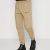 Mennace ESSENTIAL REGULAR JOGGER - Tracksuit Bottoms - Light Brown 1 Mennace ESSENTIAL REGULAR JOGGER - Tracksuit Bottoms - Light Brown -Mennace Shop Online ce814669c106429395b005f6eb4e70c4