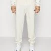 Mennace REGULAR JOGGER - Tracksuit Bottoms - Off White -Mennace Shop Online f55602c6350447a9baf2de324a699a14